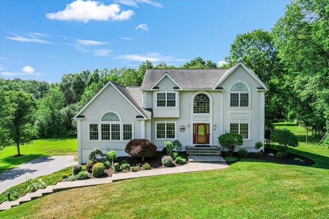 48 Brennan Ct, Chester, NY 10918 - view of front of home with a front lawn, stucco siding, and roof with shingles