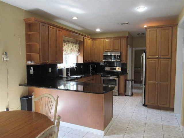 48 Brennan Ct, Chester, NY 10918 - kitchen with appliances with stainless steel finishes, a peninsula, open shelves, backsplash, and dark countertops