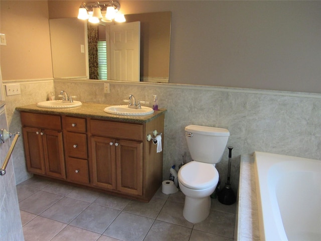48 Brennan Ct, Chester, NY 10918 - bathroom with double vanity, a tub, tile walls, wainscoting, and tile patterned floors