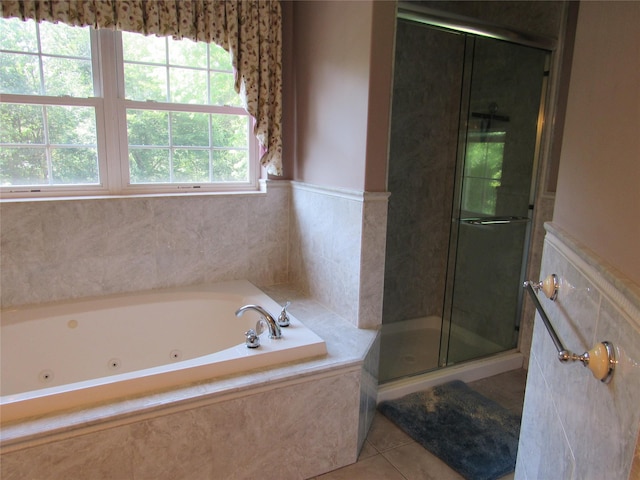 48 Brennan Ct, Chester, NY 10918 - bathroom featuring a shower stall, a tub with jets, tile patterned flooring, and wainscoting