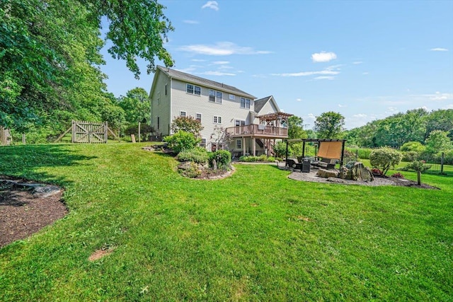 48 Brennan Ct, Chester, NY 10918 - rear view of house with a wooden deck, a lawn, a patio area, and an outdoor hangout area