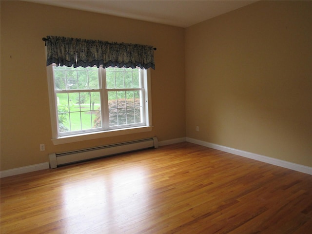 48 Brennan Ct, Chester, NY 10918 - unfurnished room with a baseboard radiator and wood finished floors