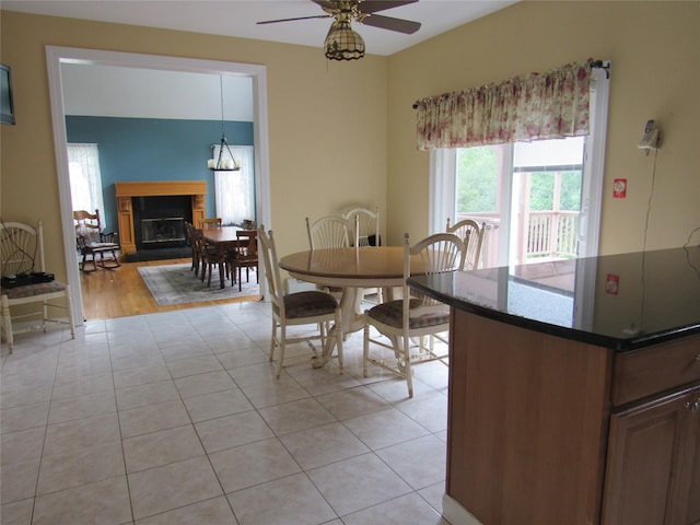 48 Brennan Ct, Chester, NY 10918 - dining area with a ceiling fan, light tile patterned floors, and a glass covered fireplace