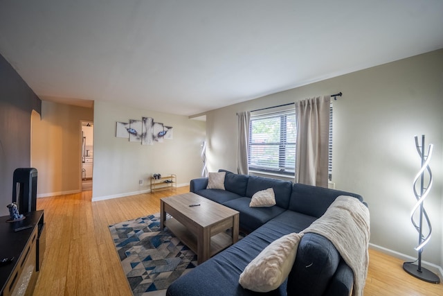 218-12 73rd Ave Unit 401A1, Oakland Gardens, NY 11364 - living room featuring wood finished floors and baseboards