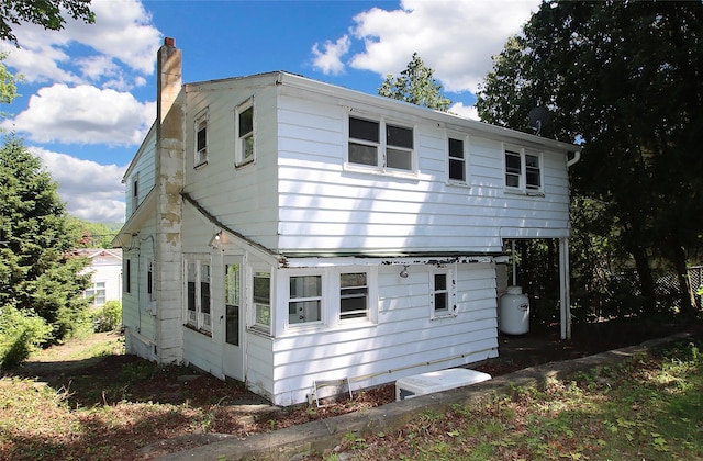 1565 Rte 292, Holmes, NY 12531 - back of house featuring a chimney
