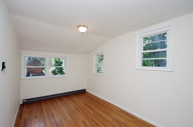 1565 Rte 292, Holmes, NY 12531 - empty room with a baseboard radiator, wood finished floors, and lofted ceiling