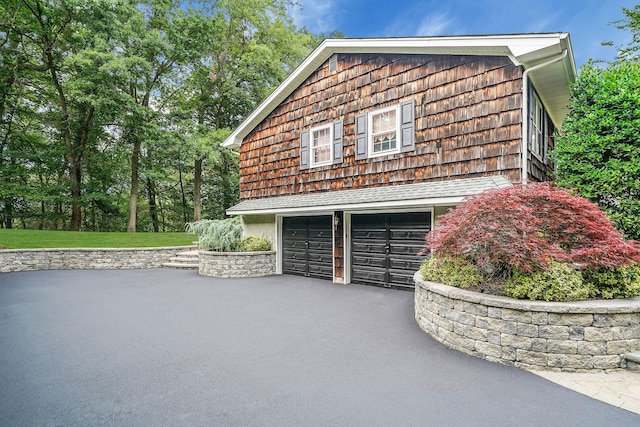 30 Twixt Hills Rd, Saint James, NY 11780 - view of home's exterior with asphalt driveway and a garage