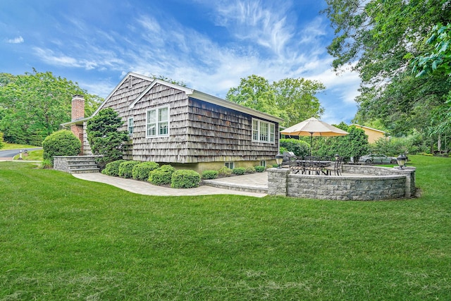 30 Twixt Hills Rd, Saint James, NY 11780 - view of grassy yard featuring a patio