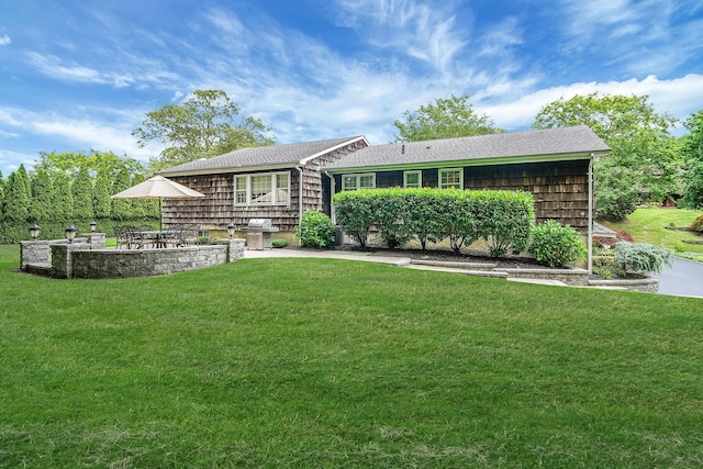 30 Twixt Hills Rd, Saint James, NY 11780 - view of front of home featuring a front yard, roof with shingles, and a patio