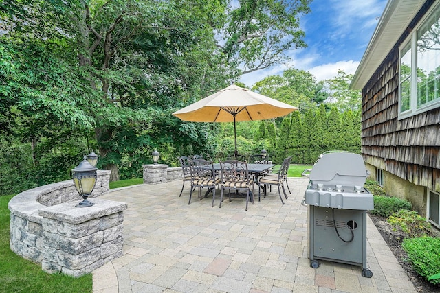 30 Twixt Hills Rd, Saint James, NY 11780 - view of patio / terrace with a grill, outdoor dining space, and view of scattered trees