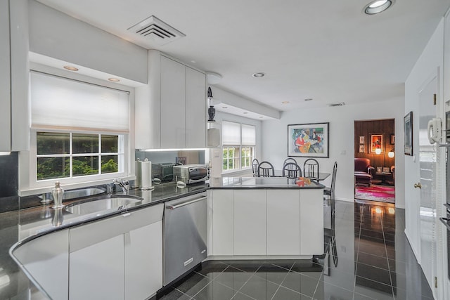30 Twixt Hills Rd, Saint James, NY 11780 - kitchen featuring dishwasher, a peninsula, white cabinetry, dark countertops, and recessed lighting