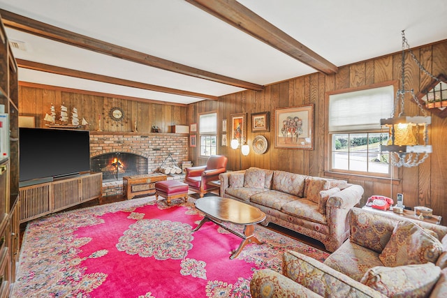 30 Twixt Hills Rd, Saint James, NY 11780 - living area with plenty of natural light, beam ceiling, wooden walls, and a fireplace