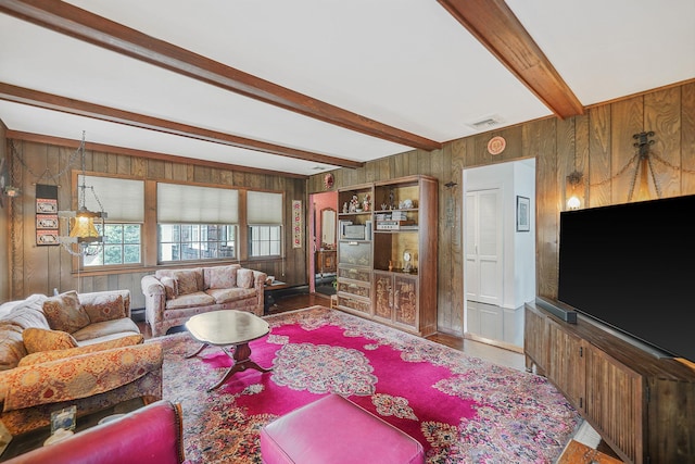 30 Twixt Hills Rd, Saint James, NY 11780 - living area with wood walls, beam ceiling, and wood finished floors