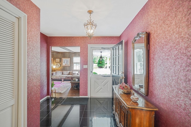 30 Twixt Hills Rd, Saint James, NY 11780 - entrance foyer with wallpapered walls, granite tiled floors, and a chandelier