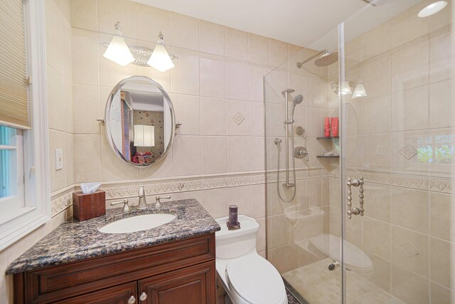 30 Twixt Hills Rd, Saint James, NY 11780 - bathroom with a shower stall, tile walls, and vanity