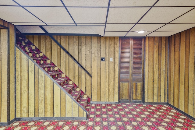 30 Twixt Hills Rd, Saint James, NY 11780 - finished basement featuring a paneled ceiling, wood walls, and tile patterned floors