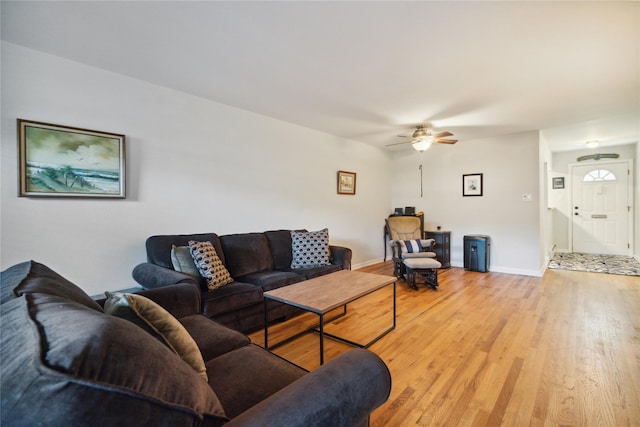4428 Wilshire Ln Unit J28, Oakdale, NY 11769 - living area with a ceiling fan and light wood finished floors