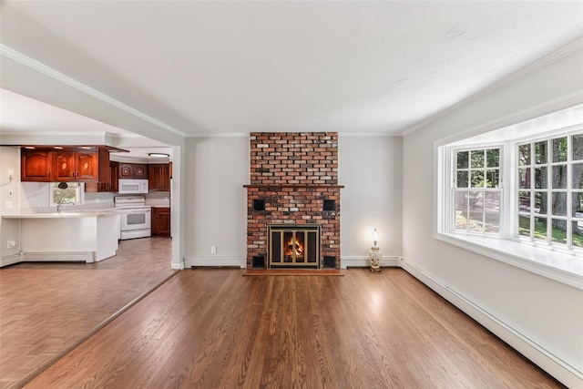 6 Cold Spring Ln, Huntington, NY 11743 - unfurnished living room featuring a baseboard heating unit, a baseboard radiator, a fireplace, wood finished floors, and crown molding