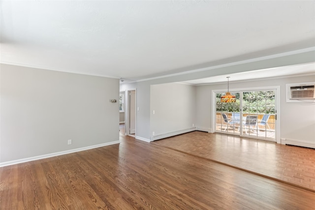 6 Cold Spring Ln, Huntington, NY 11743 - spare room with a baseboard radiator, wood finished floors, and an AC wall unit