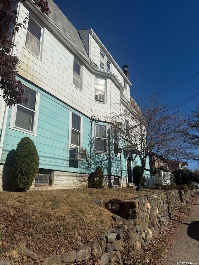 43-67 149th St, Flushing, NY 11355 - view of front of property featuring a chimney and cooling unit