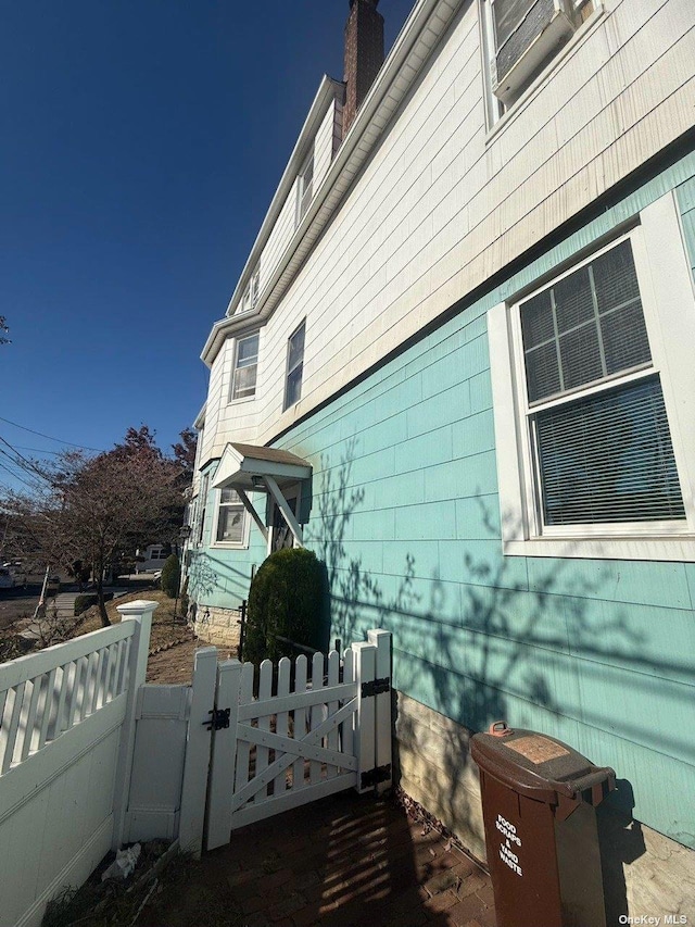 43-67 149th St, Flushing, NY 11355 - view of side of home featuring a gate