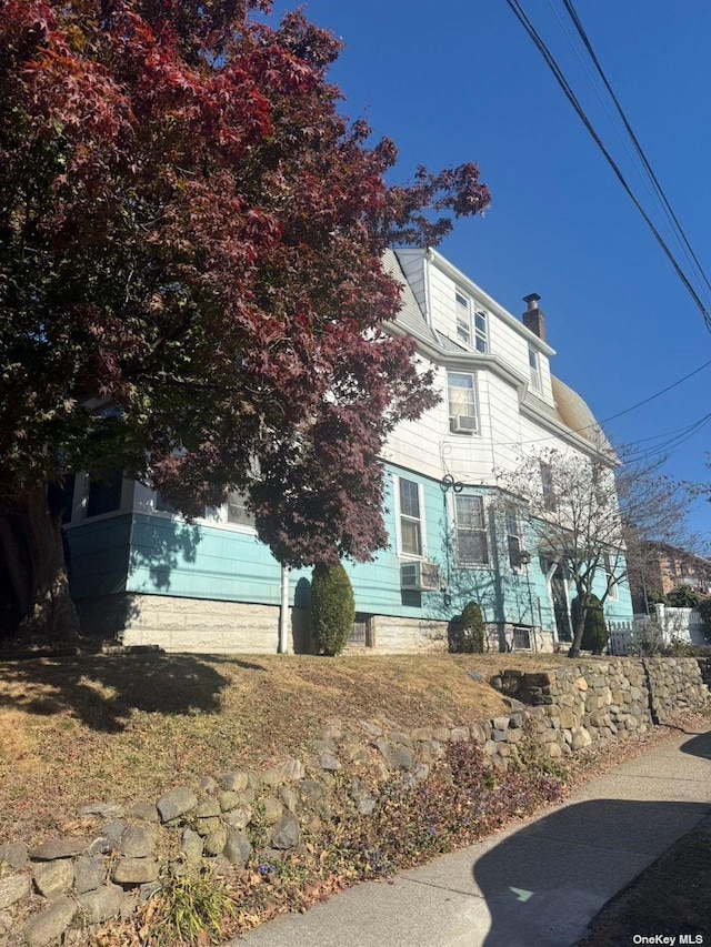 43-67 149th St, Flushing, NY 11355 - view of front of property featuring a chimney