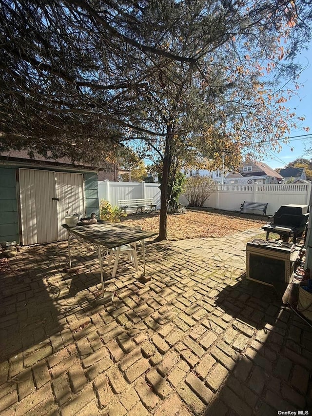 43-67 149th St, Flushing, NY 11355 - fenced backyard featuring a patio area, outdoor dining area, and a shed