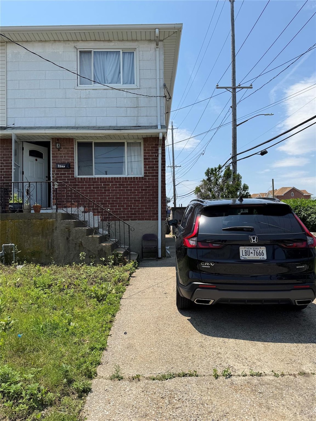 357 Bch 88th St, Rockaway Beach, NY 11693 - view of front of home with brick siding