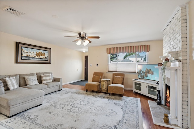 88 E Valley Stream Blvd Unit 7, Valley Stream, NY 11580 - living area featuring ceiling fan, a warm lit fireplace, and wood finished floors