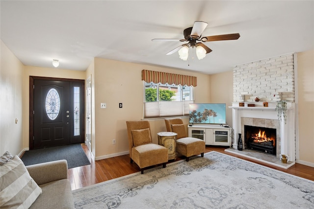 88 E Valley Stream Blvd Unit 7, Valley Stream, NY 11580 - entryway featuring wood finished floors, a fireplace, and ceiling fan