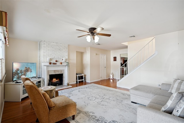 88 E Valley Stream Blvd Unit 7, Valley Stream, NY 11580 - living area with ceiling fan, stairs, a brick fireplace, and wood finished floors