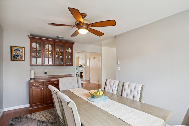 88 E Valley Stream Blvd Unit 7, Valley Stream, NY 11580 - dining area featuring a ceiling fan and dark wood-style flooring