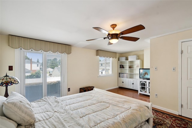 88 E Valley Stream Blvd Unit 7, Valley Stream, NY 11580 - bedroom featuring dark wood-style flooring, access to exterior, and ceiling fan