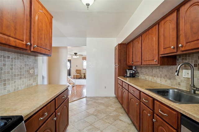 88 E Valley Stream Blvd Unit 7, Valley Stream, NY 11580 - kitchen with backsplash, light countertops, ceiling fan, stainless steel dishwasher, and electric range oven