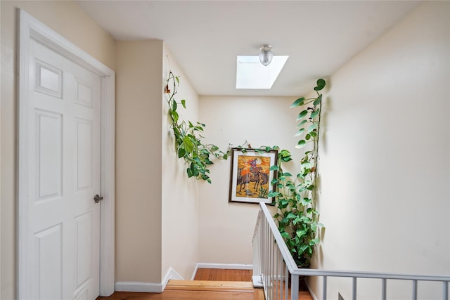 88 E Valley Stream Blvd Unit 7, Valley Stream, NY 11580 - stairway with a skylight and wood finished floors