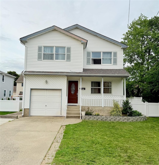 467 Scranton Ave, Lynbrook, NY 11563 - view of front of house with a garage, covered porch, and concrete driveway