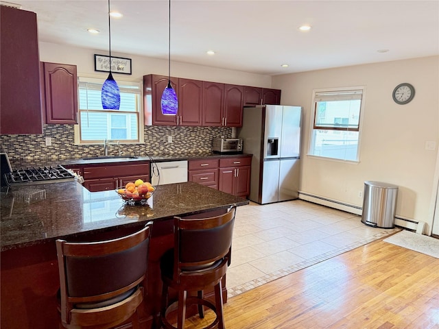 467 Scranton Ave, Lynbrook, NY 11563 - kitchen featuring stainless steel refrigerator with ice dispenser, a baseboard heating unit, dishwasher, tasteful backsplash, and recessed lighting