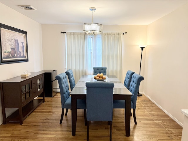 467 Scranton Ave, Lynbrook, NY 11563 - dining room featuring a chandelier and light wood finished floors
