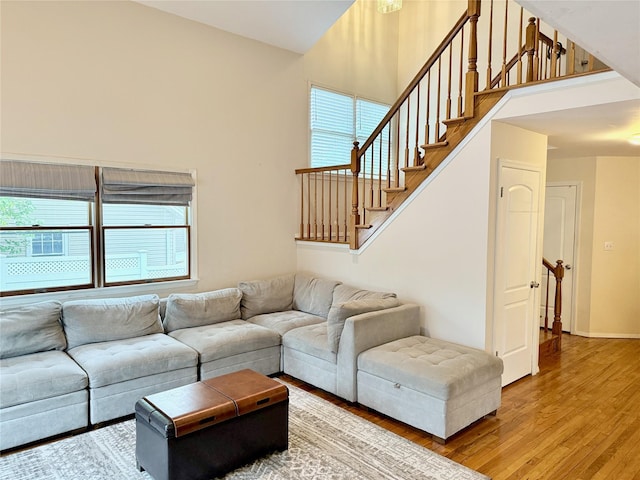467 Scranton Ave, Lynbrook, NY 11563 - living area featuring light wood-type flooring, a high ceiling, and stairway
