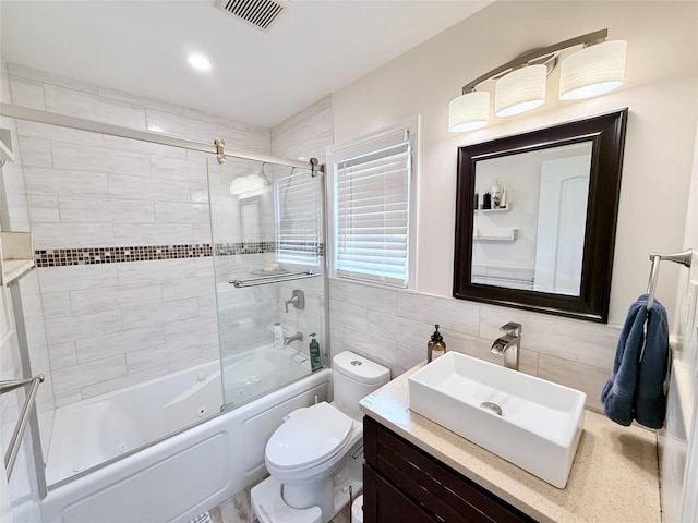 467 Scranton Ave, Lynbrook, NY 11563 - bathroom with tile walls, vanity, and a combined bath / shower with jetted tub