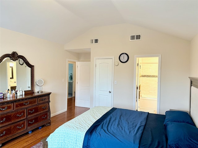 467 Scranton Ave, Lynbrook, NY 11563 - bedroom featuring vaulted ceiling, wood finished floors, and ensuite bath
