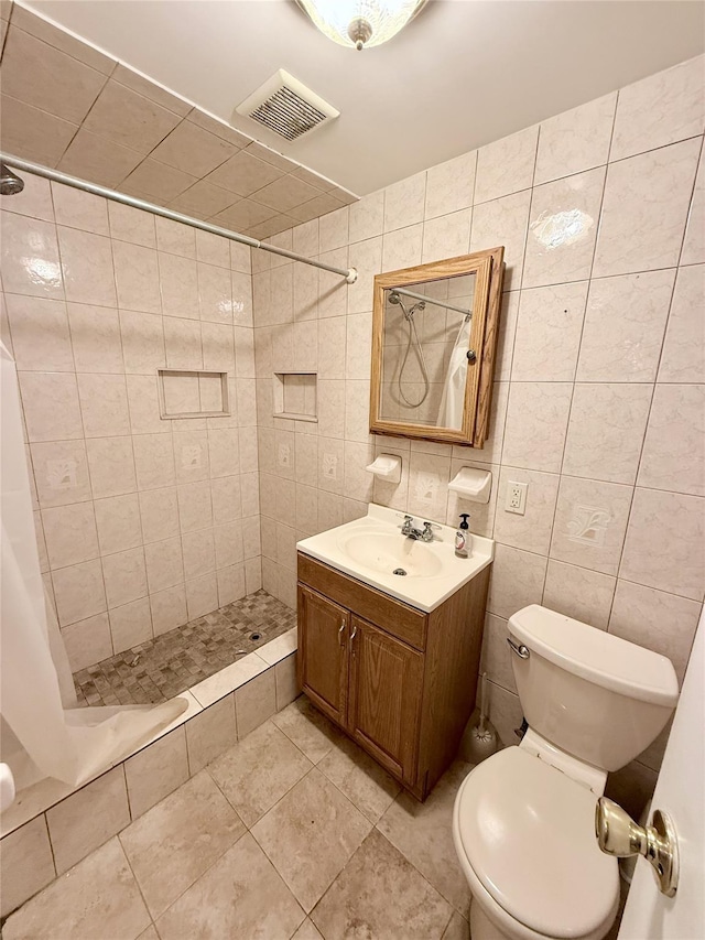 467 Scranton Ave, Lynbrook, NY 11563 - bathroom featuring tile walls, a shower stall, vanity, and tile patterned floors