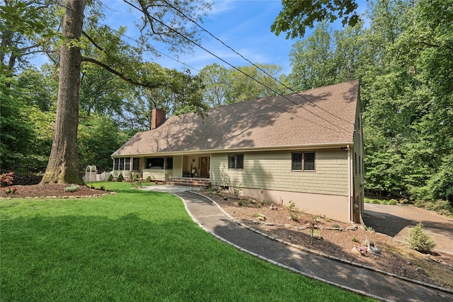 23 Bacon Rd, Head Of The Harbor, NY 11780 - view of front of home featuring a porch, a chimney, a front yard, and a shingled roof