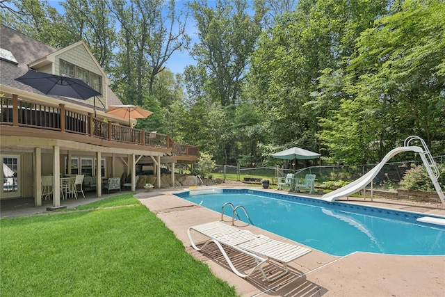 23 Bacon Rd, Head Of The Harbor, NY 11780 - view of swimming pool with a water slide, a patio, a fenced backyard, a wooden deck, and a diving board