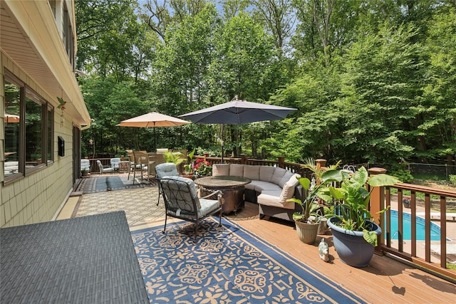 23 Bacon Rd, Head Of The Harbor, NY 11780 - wooden terrace with an outdoor hangout area, view of scattered trees, and a patio area