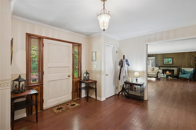 23 Bacon Rd, Head Of The Harbor, NY 11780 - entrance foyer featuring plenty of natural light, hardwood / wood-style floors, crown molding, and a lit fireplace