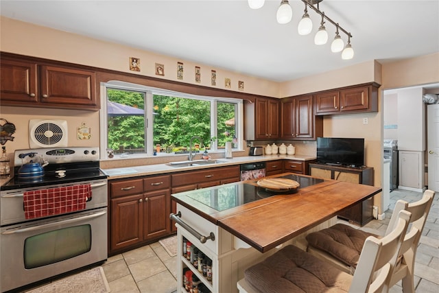 23 Bacon Rd, Head Of The Harbor, NY 11780 - kitchen with black appliances, light countertops, backsplash, light tile patterned flooring, and dark brown cabinets