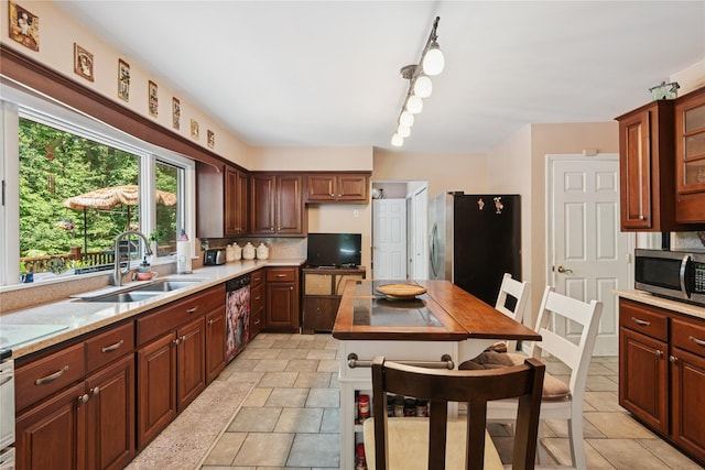 23 Bacon Rd, Head Of The Harbor, NY 11780 - kitchen with stainless steel appliances, light countertops, tasteful backsplash, and glass insert cabinets