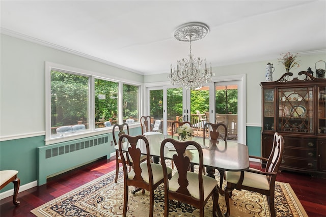 23 Bacon Rd, Head Of The Harbor, NY 11780 - dining room featuring radiator, a chandelier, french doors, crown molding, and dark wood-style floors