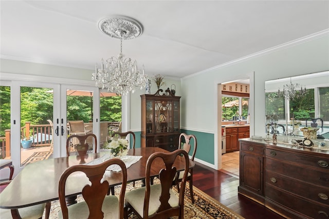 23 Bacon Rd, Head Of The Harbor, NY 11780 - dining space with a chandelier, crown molding, healthy amount of natural light, and french doors